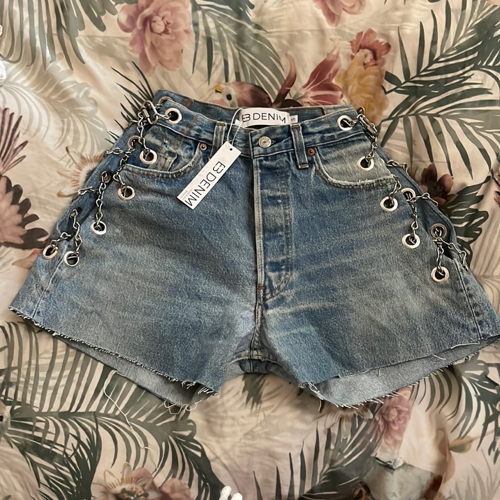 Vintage denim shorts. Stainless steel chain detail with exposed hip. Button fly